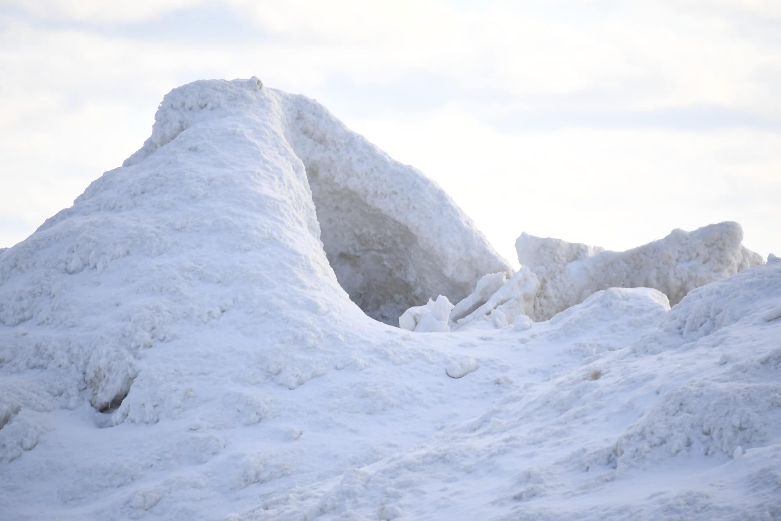 An view of an ice volcano wearing a fresh coat of powdery white snow